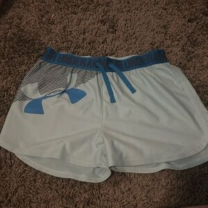 Teal shorts with blue band and black under armor wording